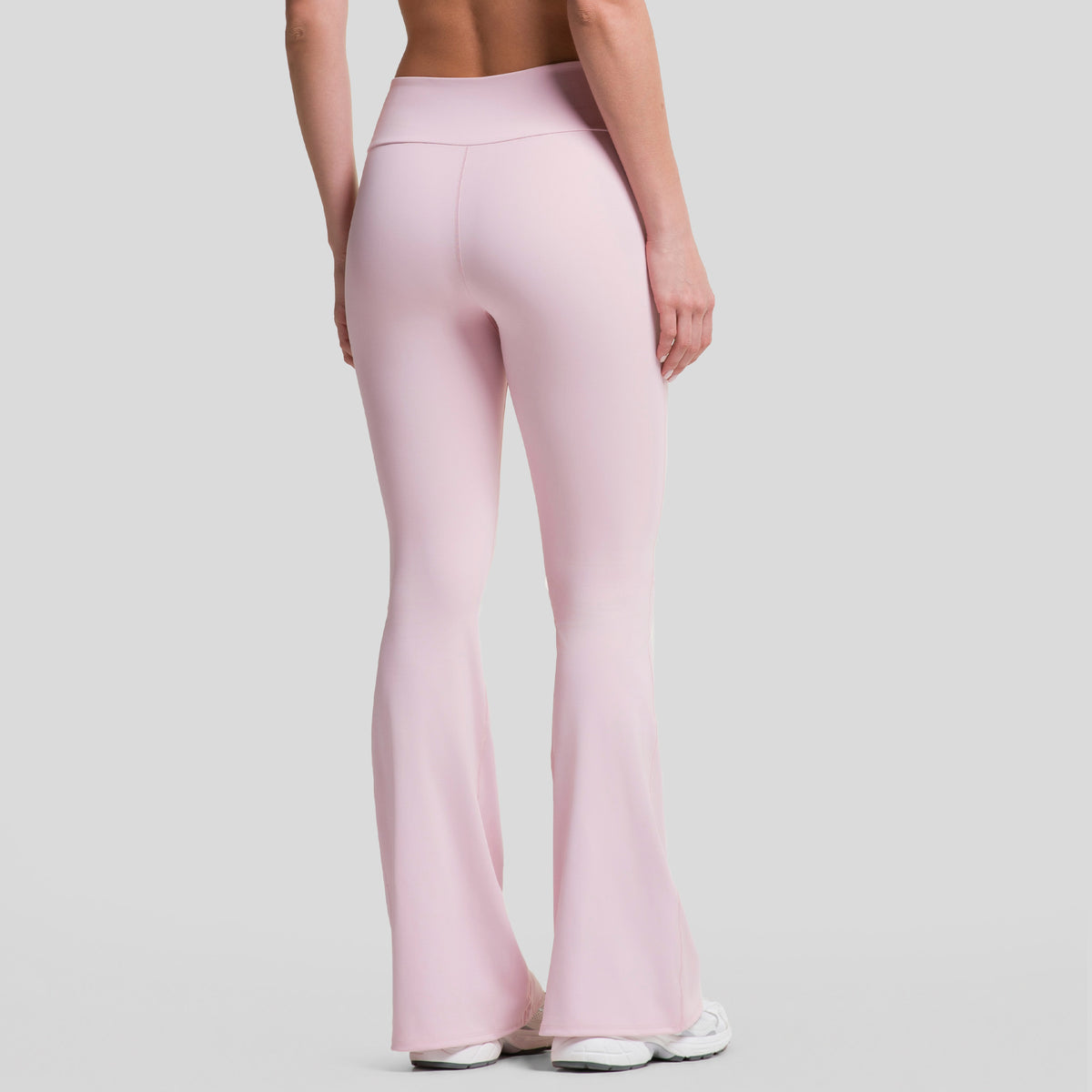 Leggings deportivos acampanados mujer rosa claro, vista trasera con tiro alto