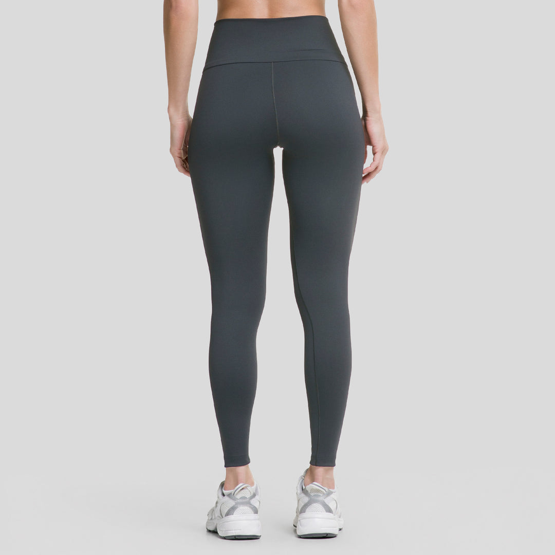 Leggings deportivos negros de mujer con pretina V y costuras definidas