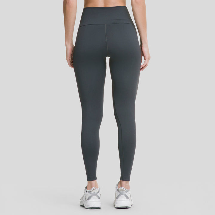 Leggings deportivos negros de mujer con pretina V y costuras definidas