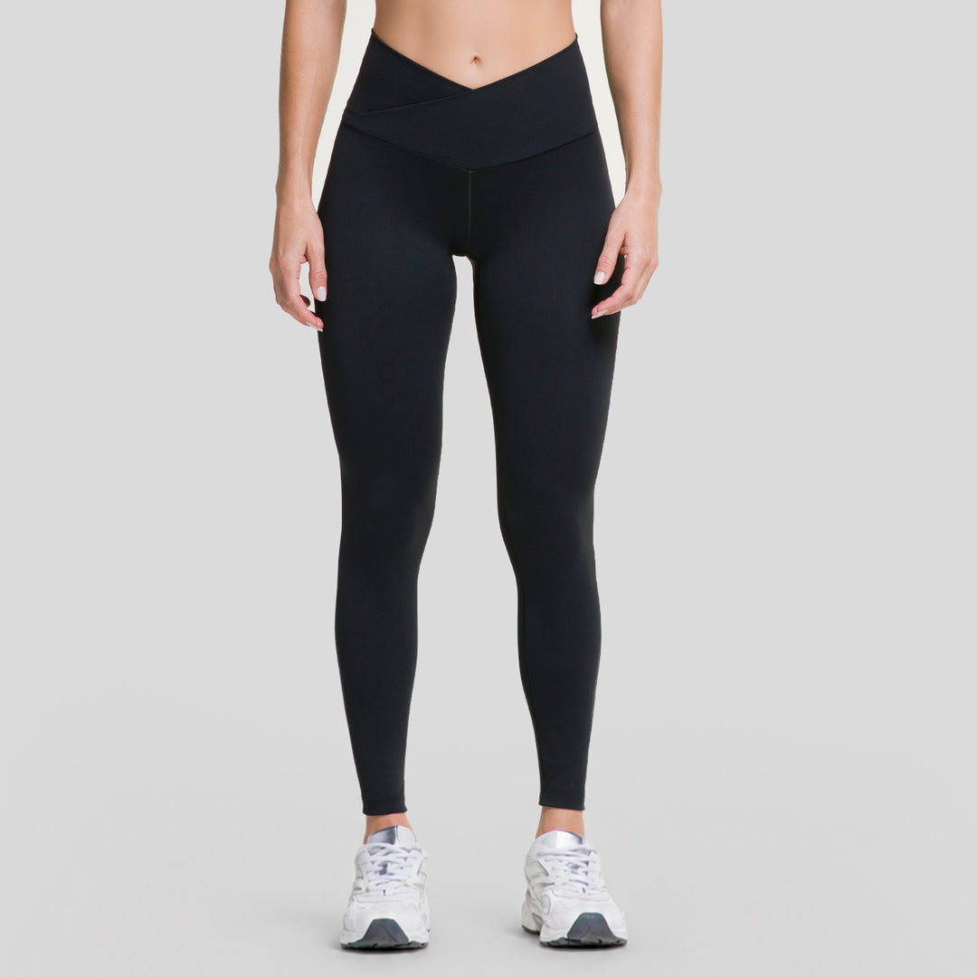 Leggings deportivos negros de mujer con pretina V y costuras laterales