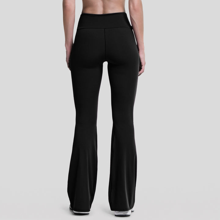 Leggings deportivos acampanados mujer negros, vista trasera con tiro alto
