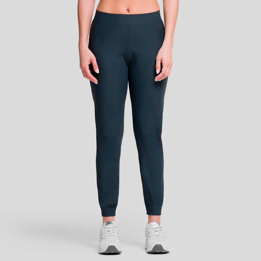 Pantalón jogger deportivo para mujer azul marino, tiro medio y puño elástico en el tobillo.