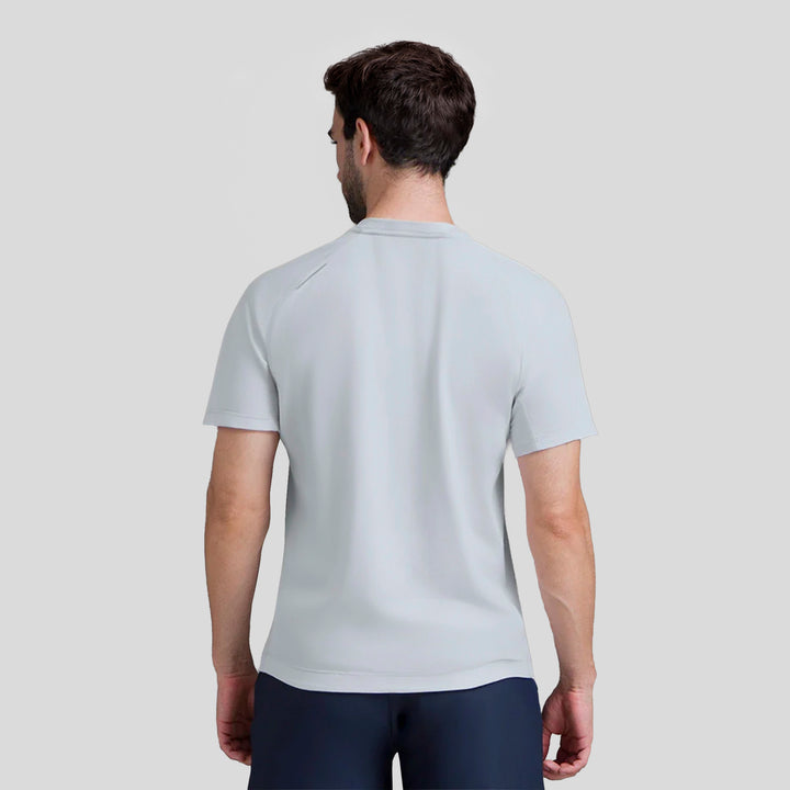 Playera deportiva de hombre azul claro vista trasera, cuello redondo y manga corta