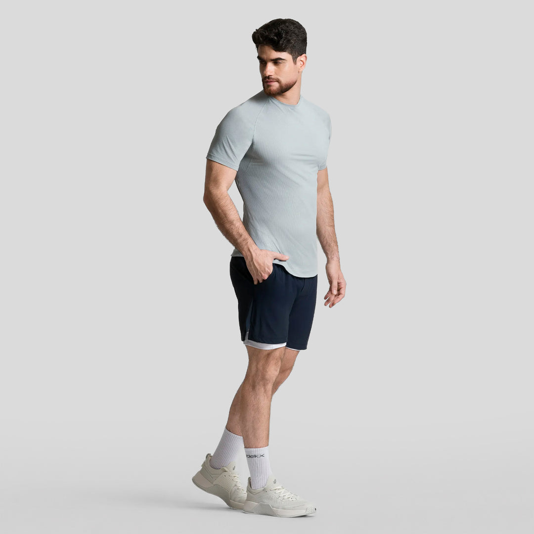 Short deportivo 2 en 1 hombre azul marino, dobladillo recto y cintura elástica.