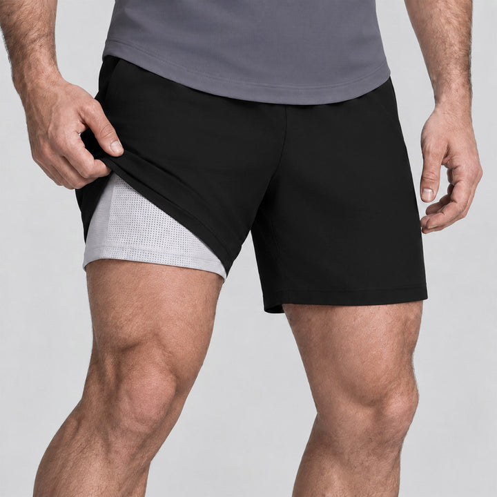 Pantalón corto 2 en 1 de hombre negro con forro interior gris tipo malla