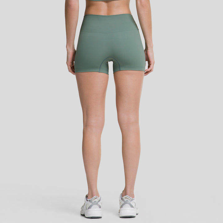 Short biker plano 3.5" para mujer ATLEKX verde, tiro alto, vista trasera