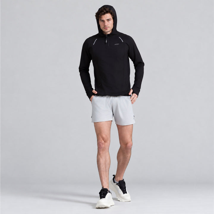 Sudadera deportiva negra con capucha ajustable y bolsillos canguro
