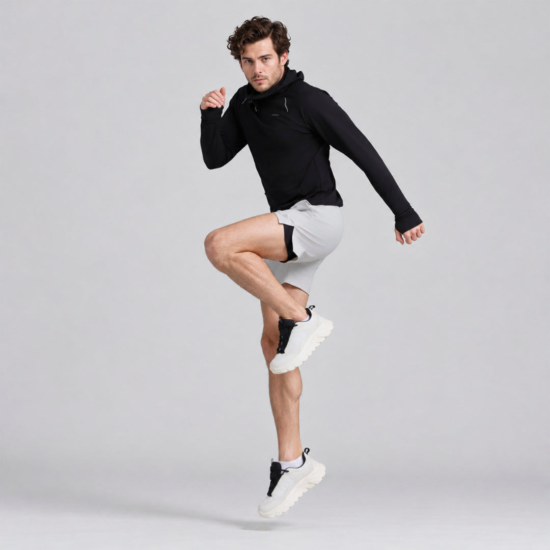 Sudadera deportiva negra con capucha y bolsillos, puños ajustados