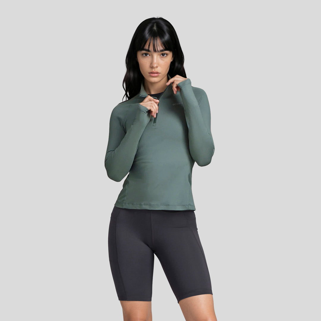 Sudadera deportiva verde con media cremallera, cuello alto y manga larga