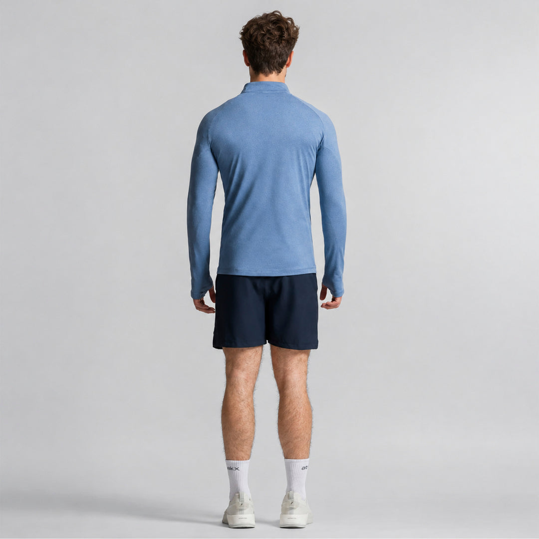 Sudadera deportiva azul para hombre, vista trasera con cremallera media y manga larga.