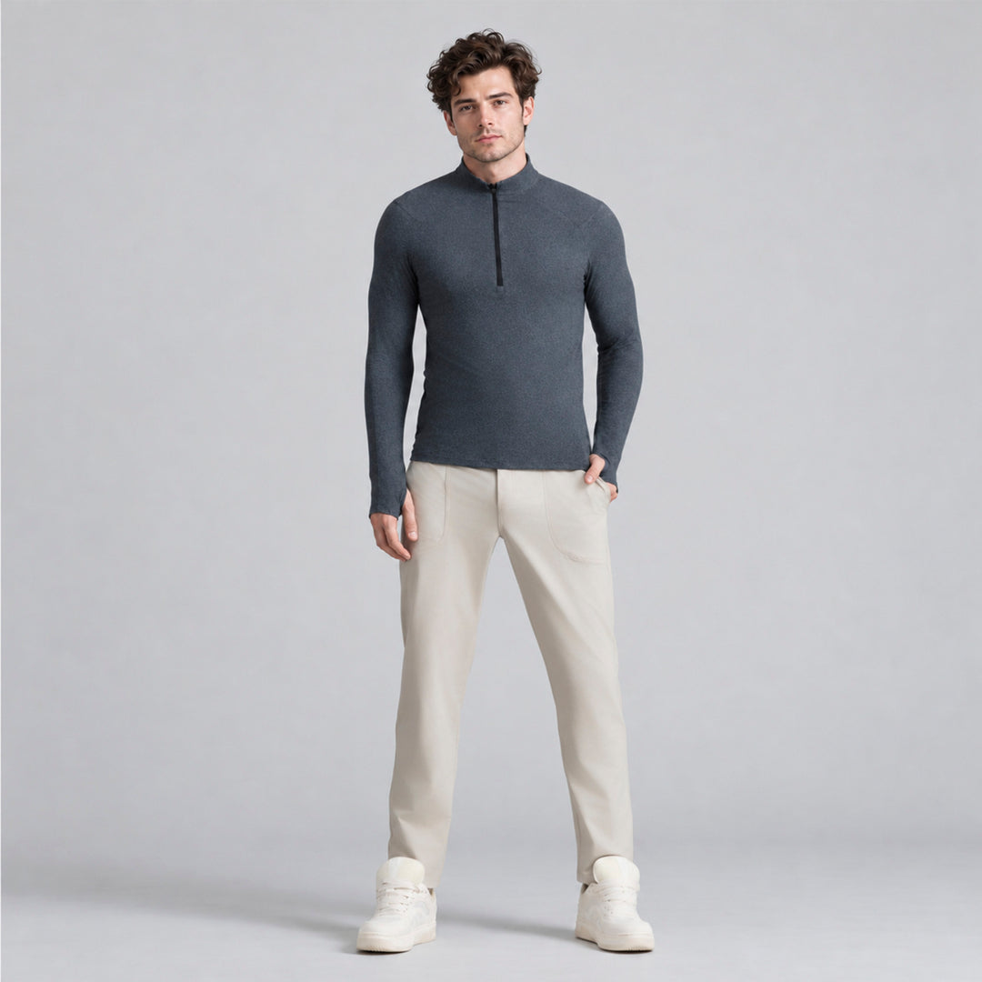 Sudadera deportiva gris para hombre con cremallera media y cuello alto.