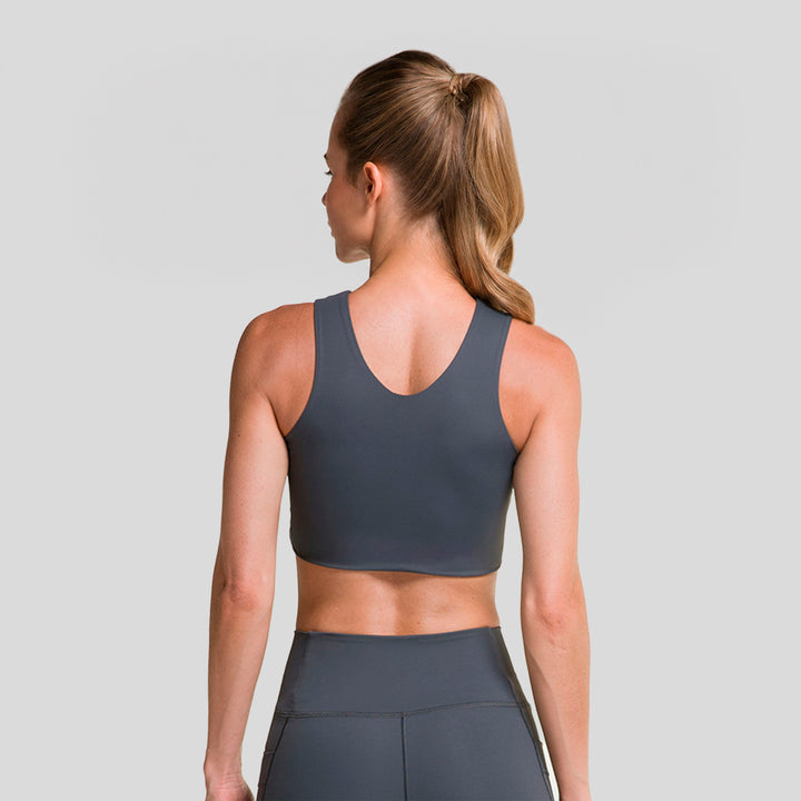 Top deportivo mujer gris oscuro, vista trasera con escote en V