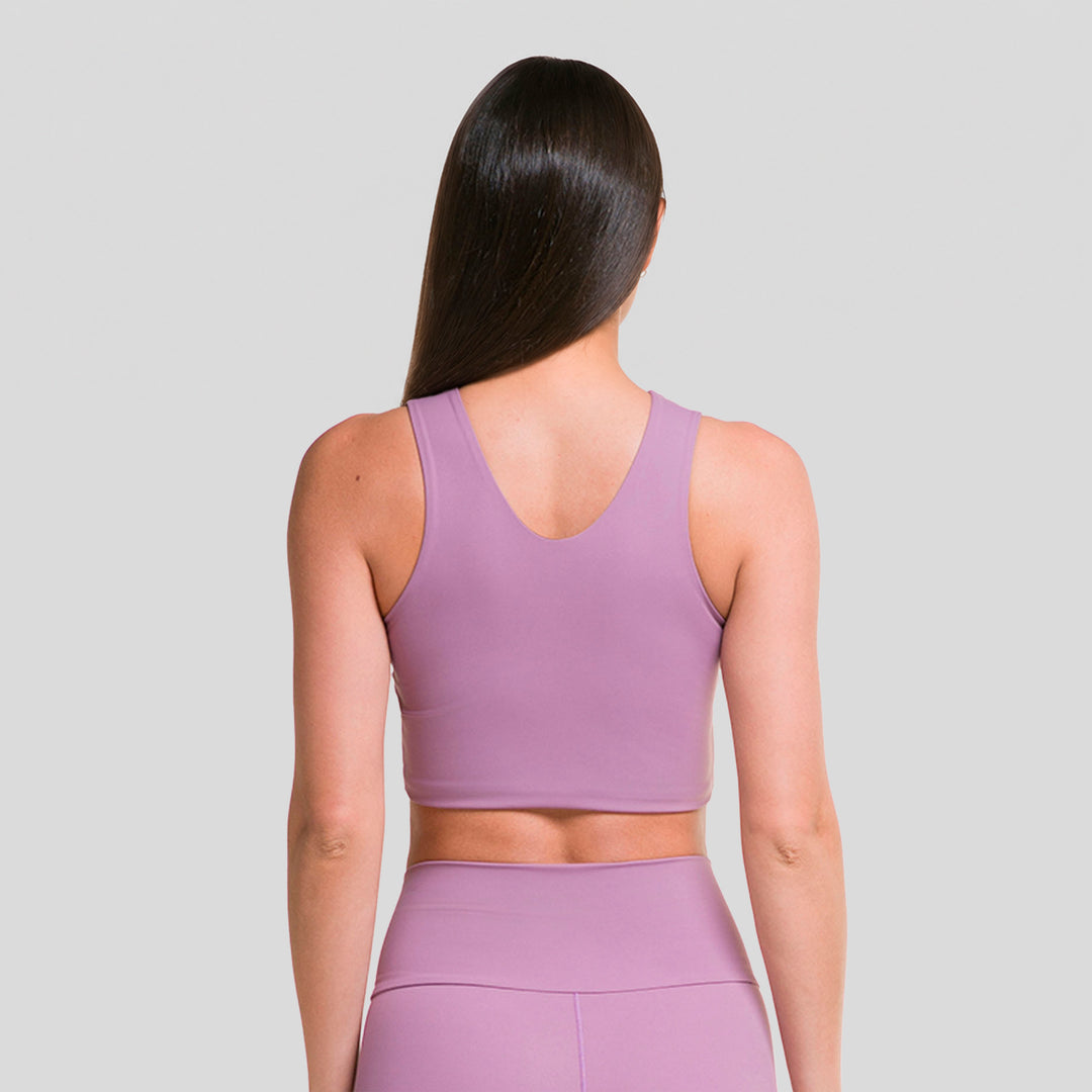 Top deportivo sin mangas de mujer morado lila, espalda descubierta y ajuste entallado