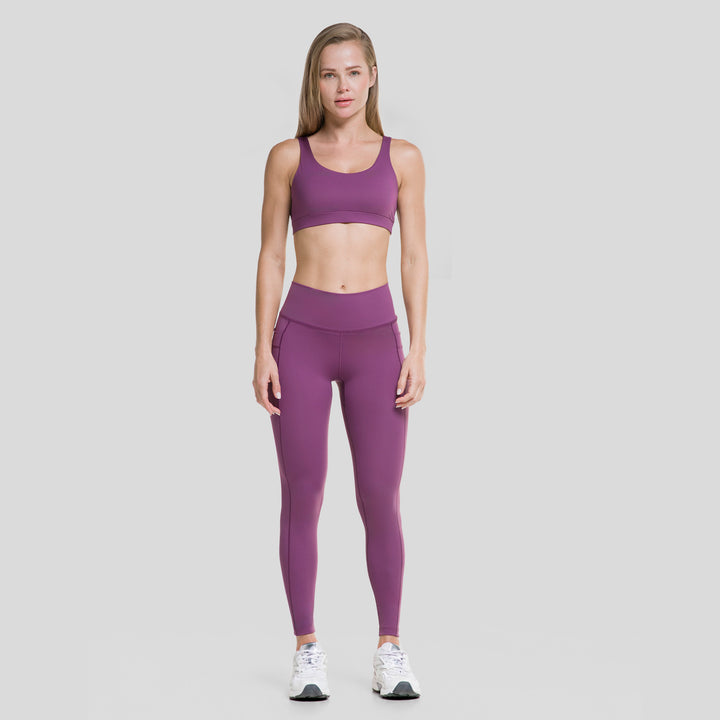 Top deportivo mujer morado con espalda cruzada, tirantes anchos y ajuste firme