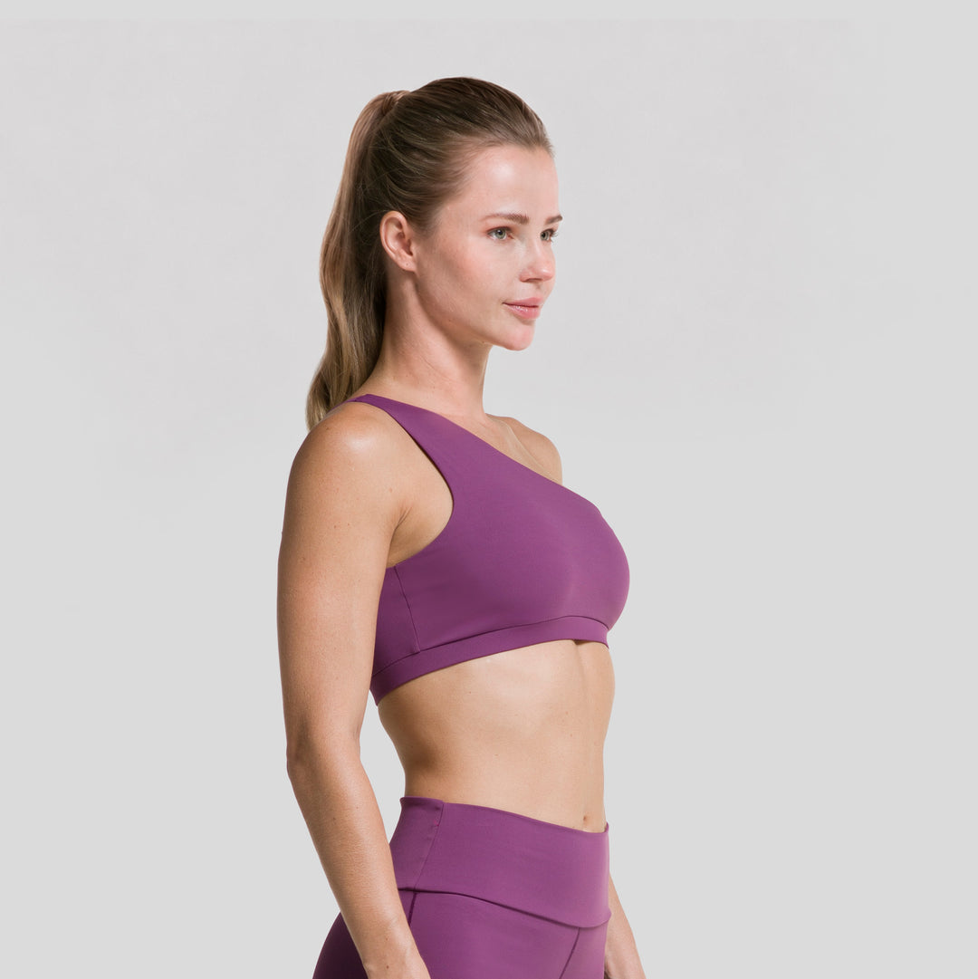 Top deportivo asimétrico de mujer ATLEKX, morado, vista lateral de un hombro