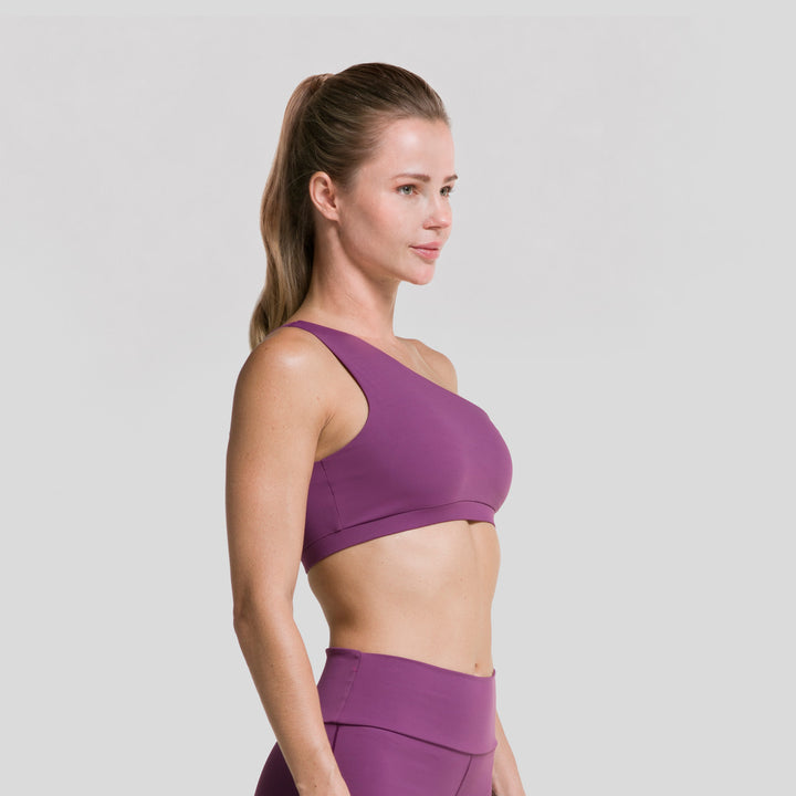 Top deportivo asimétrico de mujer ATLEKX, morado, vista lateral de un hombro