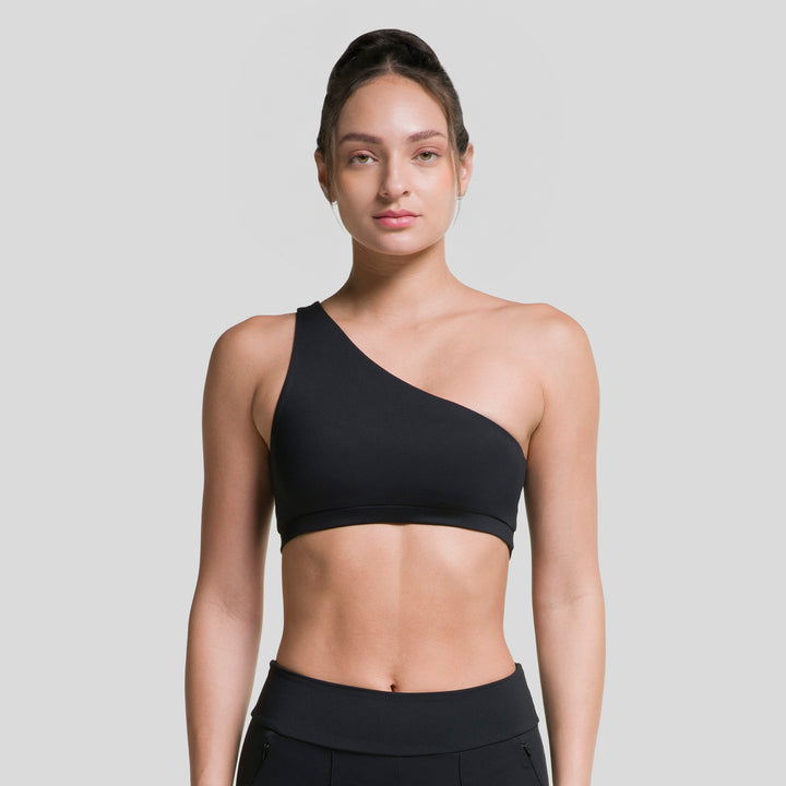 Top deportivo asimétrico negro con tirante diagonal de un hombro