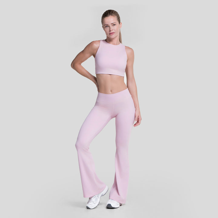 Top deportivo ATLEKX rosa claro sin mangas, corte corto y costuras planas