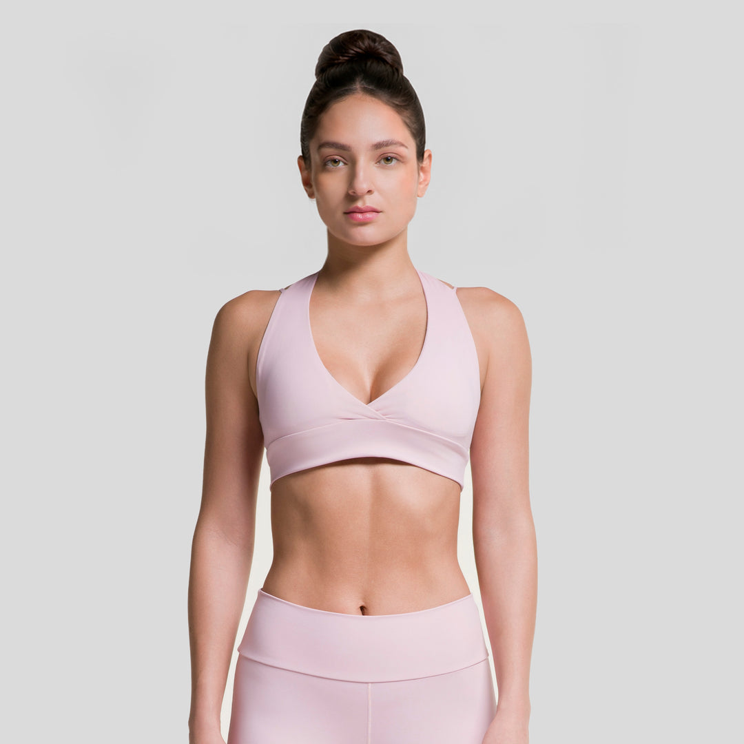 Top deportivo ATLEKX rosa claro con escote V y costuras, ajuste moldeador